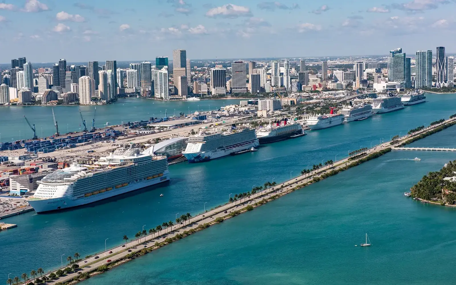 Aerial view of cruise ships at PortMiami, causeway and skyline