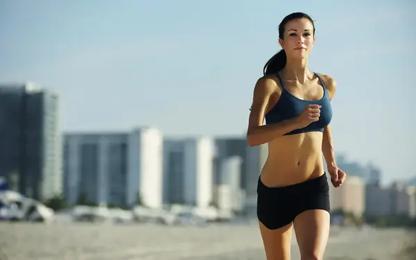 Woman running on the beach