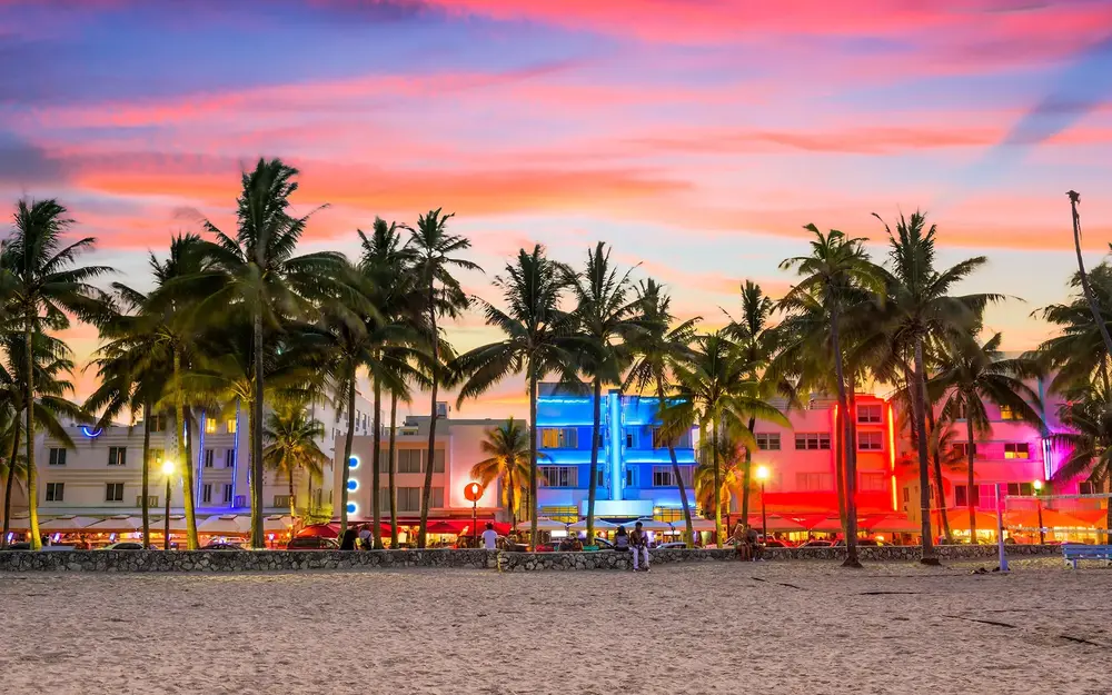 Art Deco hotels glow at night on Ocean Drive in South Beach