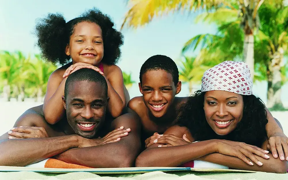 Family lying on the beach